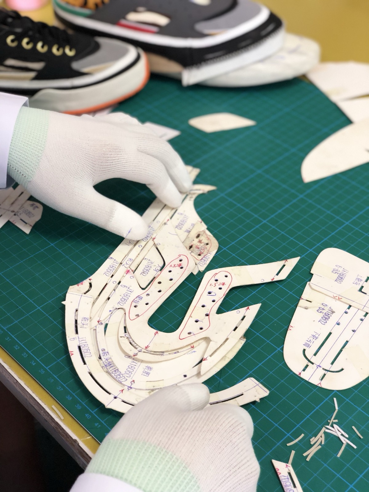Footwear design and development pattern work on a cutting mat